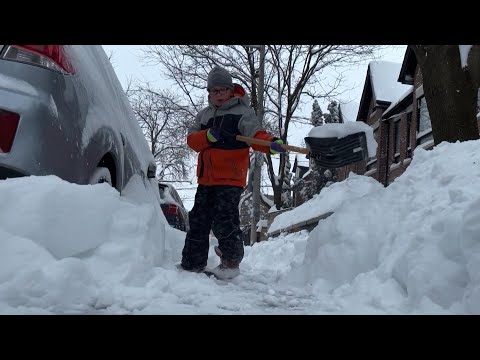 This 'Exhausted' Kid Shoveling Snow Is The Hero We All Need